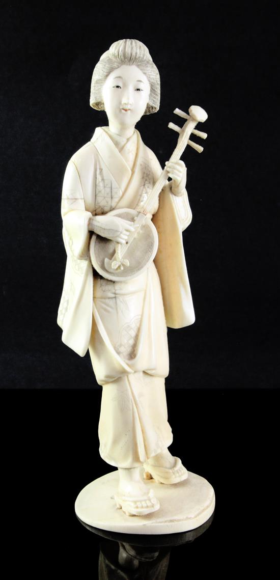 A Japanese sectional ivory figure of a bijin, early 20th century, 26.5cm